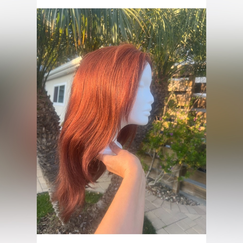 Gorgeous auburn color wig! The wig is made out of European Remy hair!